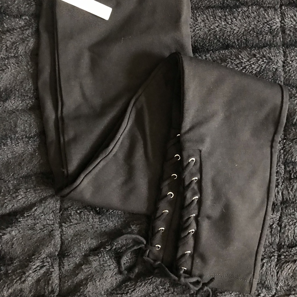 Black legging material pants.